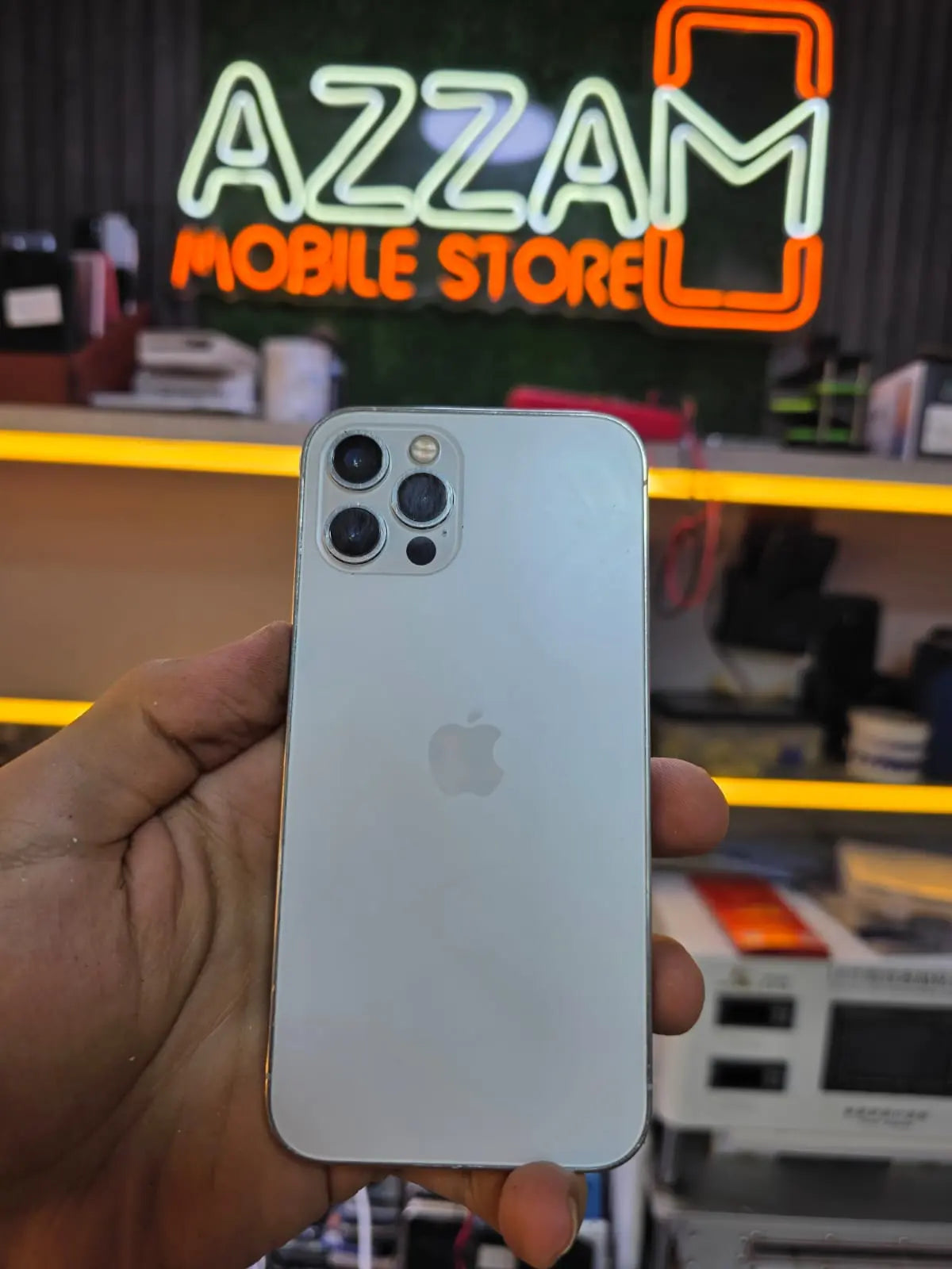 The same iPhone after a professional screen replacement and repair, showing a flawless, brand-new glossy display.